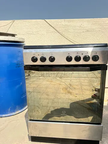 Used freestanding stainless steel oven with gas burners - good working condition