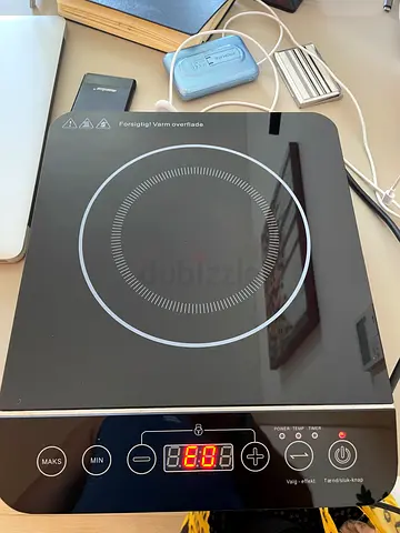 Single-burner induction cooktop — portable, works well.