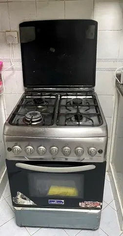 Used 4-Burner Gas Stove with Oven — Functional, Needs TLC