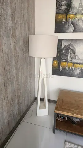 White geometric floor lamp with fabric drum shade — modern design