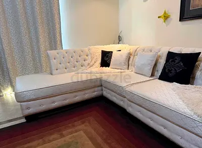 L-shaped tufted white fabric sofa sectional - good condition