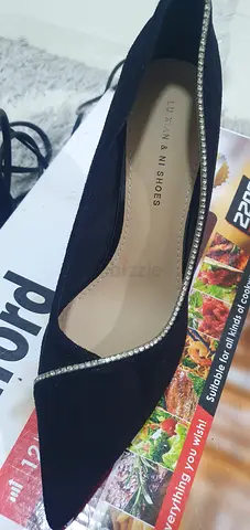 Pair of black pointed women's heels with rhinestone trim - barely worn