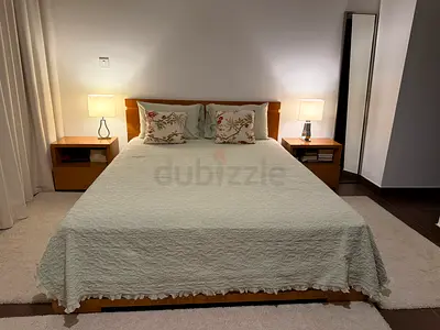 Wooden queen bed frame with matching bedside tables - excellent condition