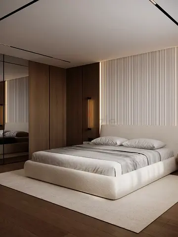 Modern low-profile upholstered double bed with neutral rug and wall cleding