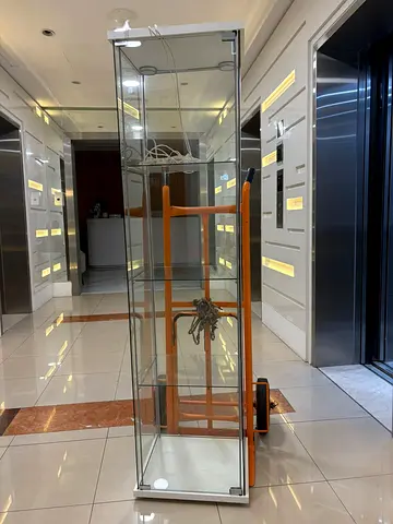 Tall glass display cabinet