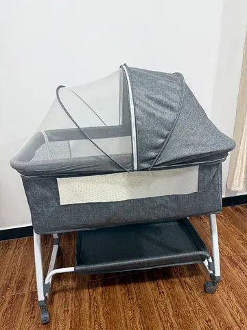 Grey Portable Bassinet with Mattress and Toy Bar