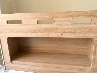 Light oak wooden headboard with built-in shelf