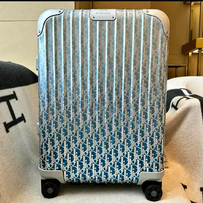 Dior and Rimowa carry on suitcase