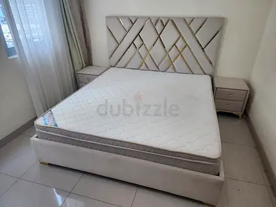 King size upholstered bed frame with mattress and two bedside tables