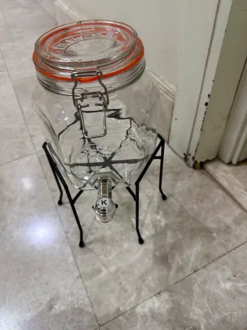 Juice dispenser with tap and stand. New