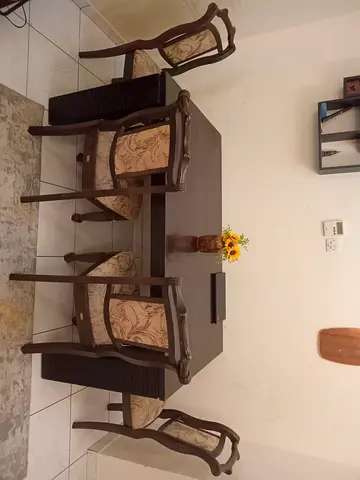 Solid wood 4-seater dining table with upholstered chairs