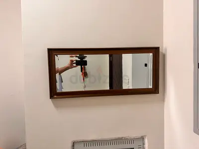 Wall-mounted rectangular framed mirror - brown wooden frame