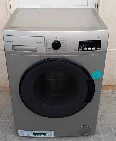 fully automatic Baumatic 7kg washing machine, grey silver, condition working good.