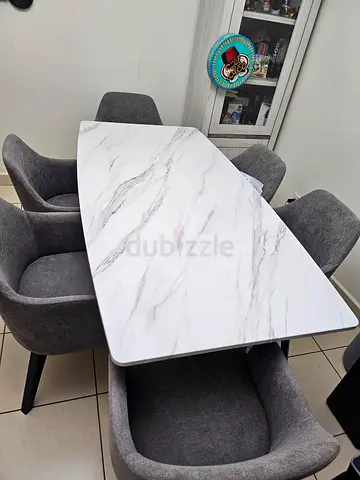 Marble top dining set with 6 comfy chairs.Very welll manainted,sparingly used,in exvellentcondition