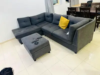 L-shaped Grey Fabric Sofa with Ottoman - Good Condition