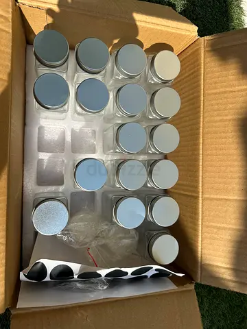 Set of 17 small glass spice jars with silver lids - unused