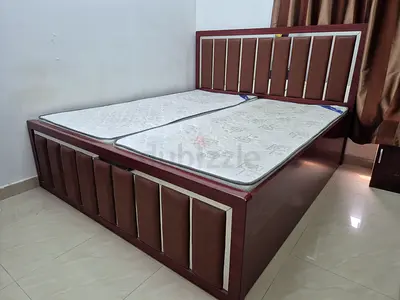 King size bed having big storage space with mattress in good condition for sale in Muwaileh Sharjah.