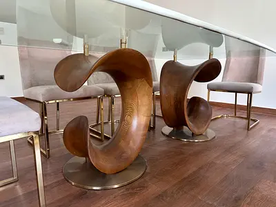 Glass Dining Table with Sculptural Wooden Wave Base طاولة طعام زجاجية بقاعدة خشبيةمنحوتة على شكل موج