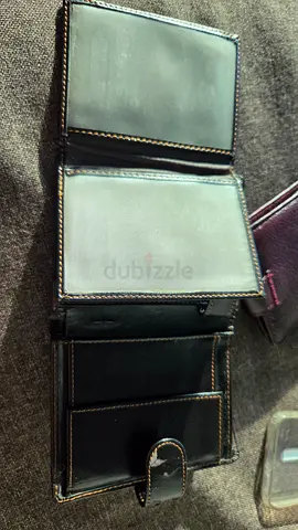 Two wallets one leather one black