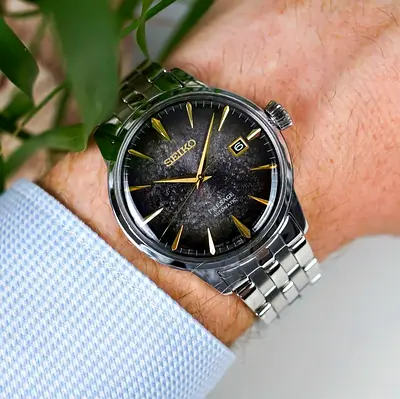 Mens stainless steel automatic watch with black dial — gently