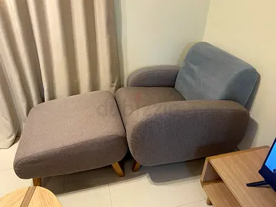 Lounge armchair with ottoman