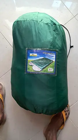 Used green sleeping bag in compression sack - good condition