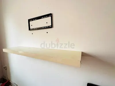 Wall-mounted floating TV shelf
