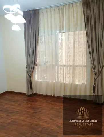 Two bedrooms, large living room, spacious and equipped kitchen, two bathrooms, high-end finishing, flexible payment options, close to the Dubai-Sharja