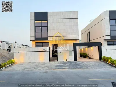 Luxury villa for sale in Al Bahia, Ajman | 6 master bedrooms | Ground floor + First floor + Roof | Freehold ownership | Registration fees included.