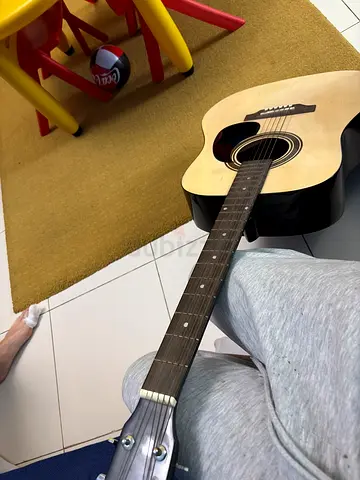 full-size acoustic guitar in good condition