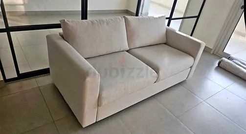 Light beige 2-seater sofa in good condition