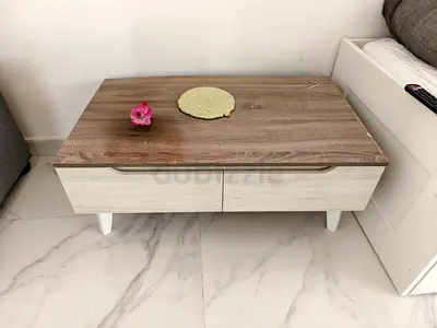 Modern two-drawer coffee table with wood finish