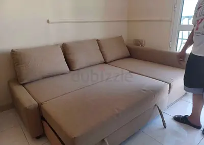 Beige L-shaped Sofa Bed - Converts to Large Bed, Good Condition