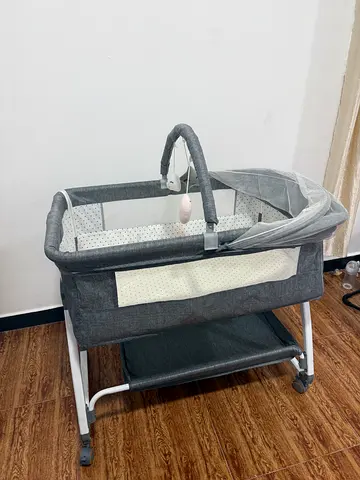 Grey Portable Bassinet with Mattress and Toy Bar