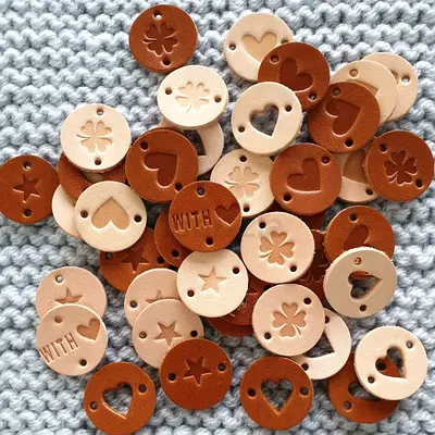Handmade round leather tags with cut-out hearts, stars and clovers - mix of tan & brown