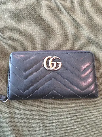 Black quilted long wallet with gold-toned double G logo