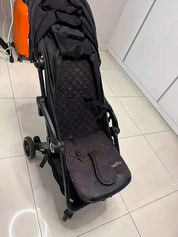 Lightweight black baby stroller — compact fold, good condition