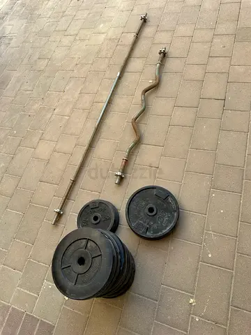 10x 5kg and 2x 10kg Weight Plates with bar and EZ curl bar
