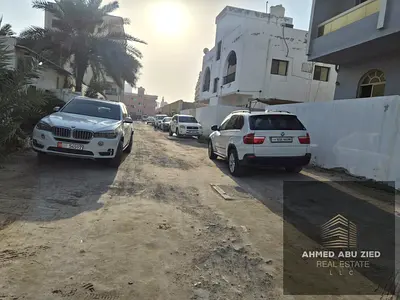 Residential Investment Plot for Sale in Liwara 1, Ajman, 4,175 sq. ft., on a street and internal road, with G+4 approval, asking price AED 1 million.
