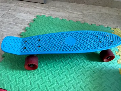 Original Penny blue skateboard with red wheels