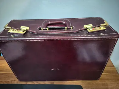 Vintage brown leather briefcase with combination locks