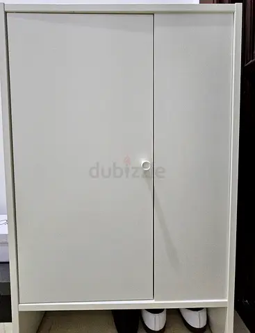 Compact white storage cabinet