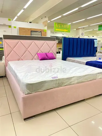 Upholstered Pink Double Bed with Diamond-Pattern Headboard