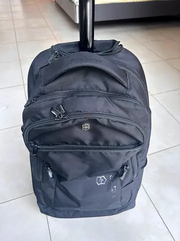 Victorinox black rolling backpack with multiple compartments - good condition