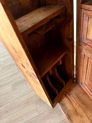 Solid wooden bar with internal shelving and storage