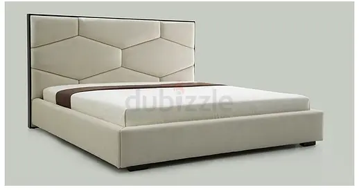 Queen upholstered platform bed with geometric padded headboard