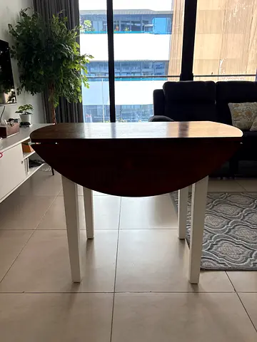 Solid wood round dining table (extendable) with two chairs.