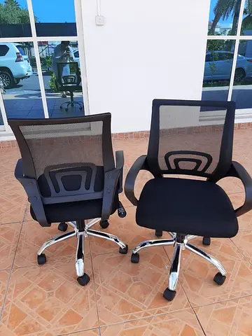 Pair of black ergonomic mesh office chairs -