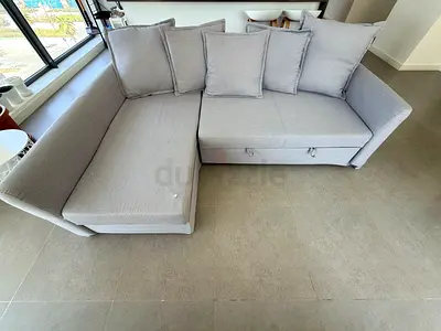 Light grey L-shaped sofa with storage, good condition