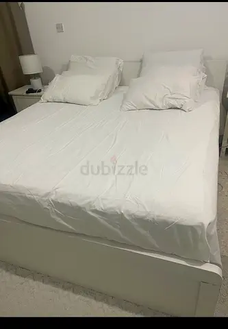 White double bed with 2 nightstands